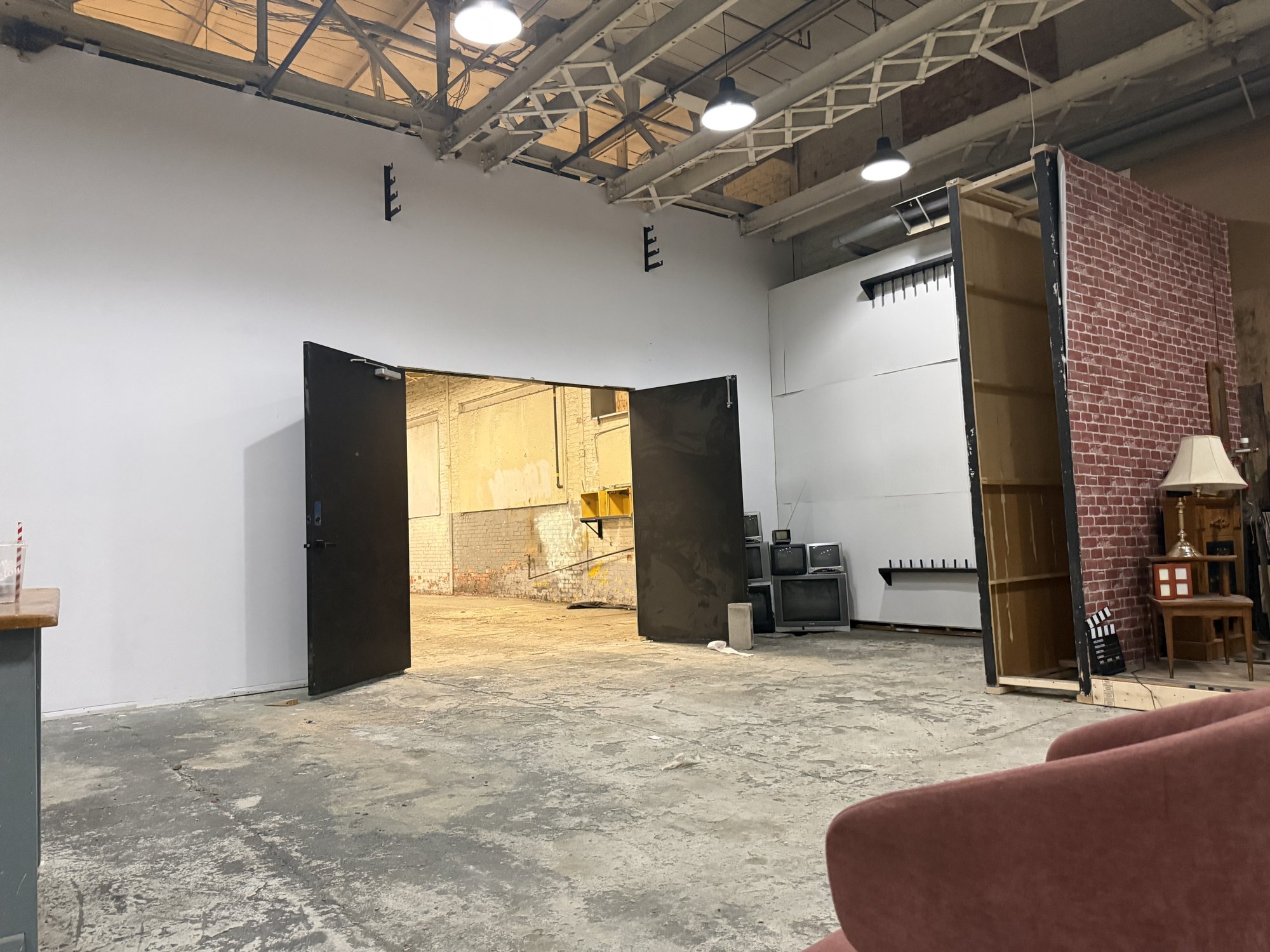 Double doors in the partition between the open studio and the build floor at 252 Stuart Street