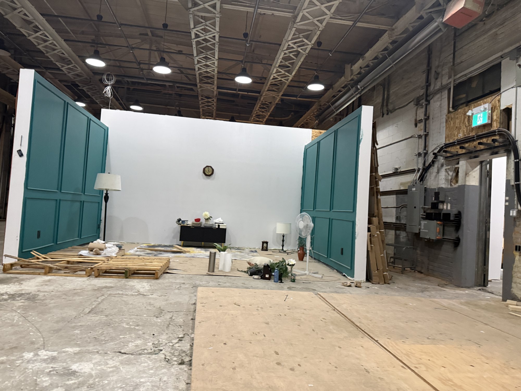 Set walls and green double doors on the studio floor at 252 Stuart Street